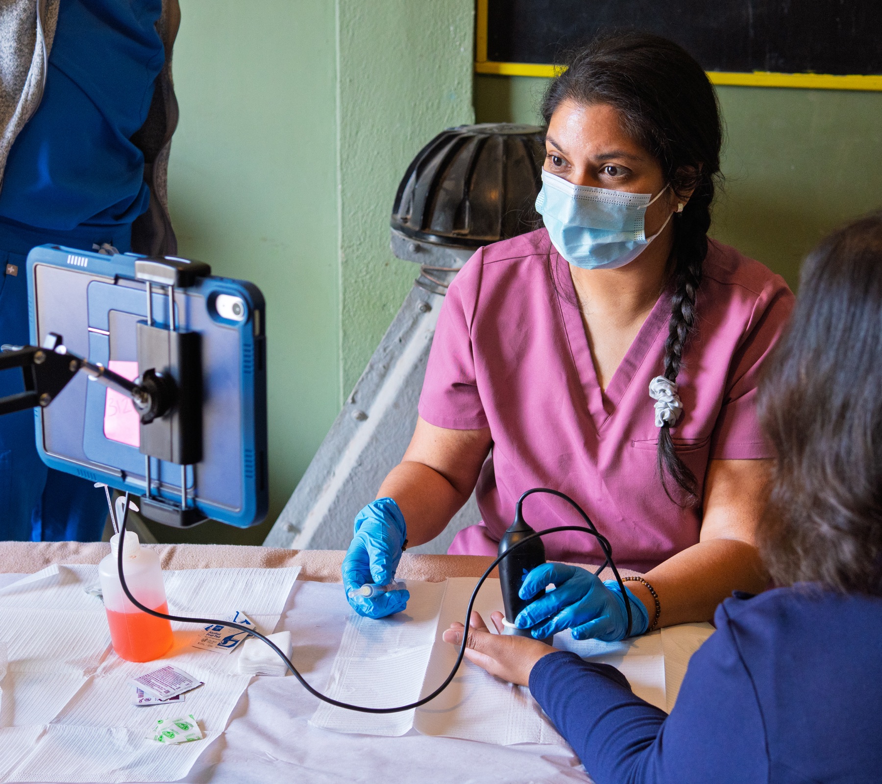 An NWB clinician providing attentive care during a community clinic in Puerto Peñasco, Mexico
