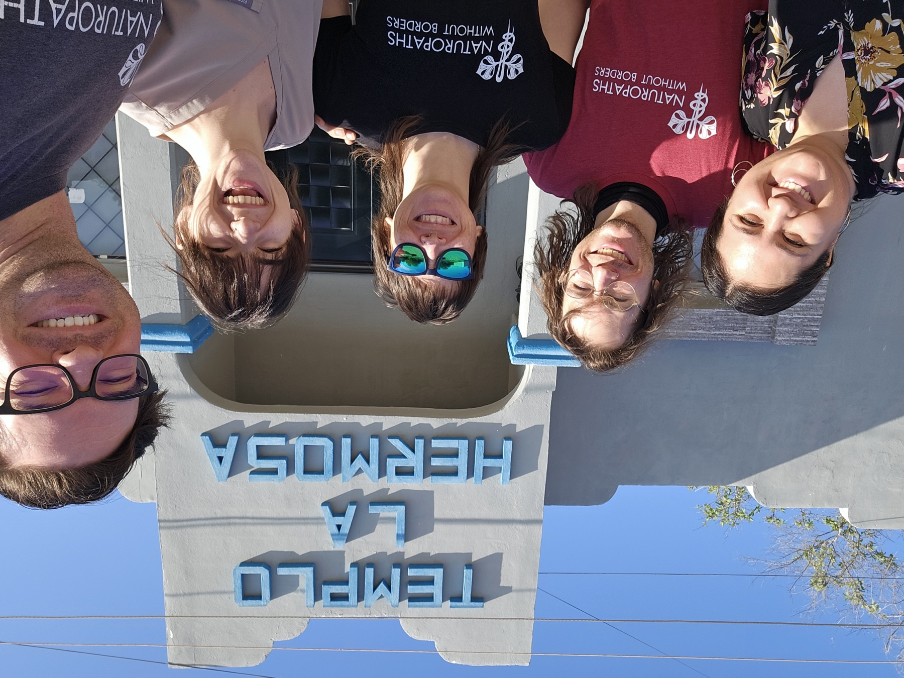 NWB volunteers smiling together outside Templo La Hermosa in Puerto Peñasco